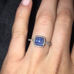 Diamond ring with blue gemstone center